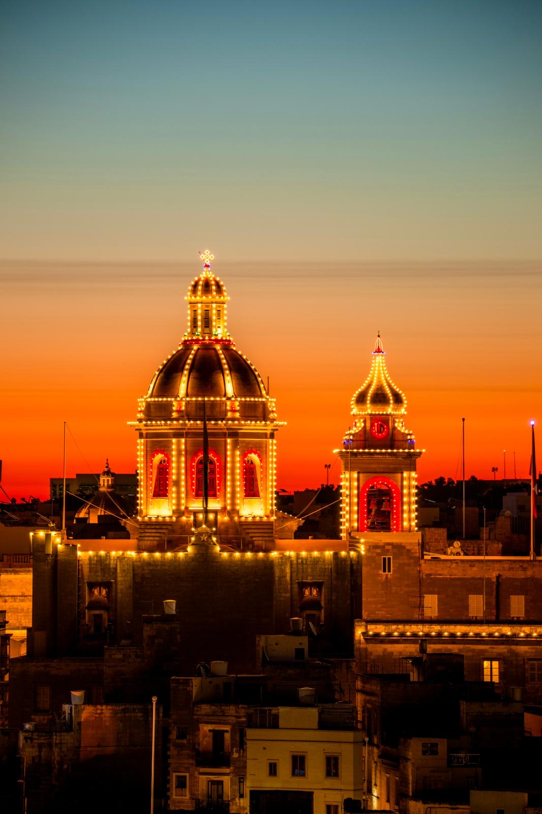 Illuminated church, seen from the Snop House, for St Dominic Feast. Photo by Daniel Cilia